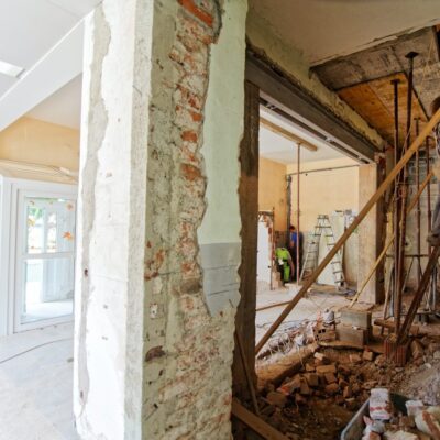 man climbing on ladder inside room